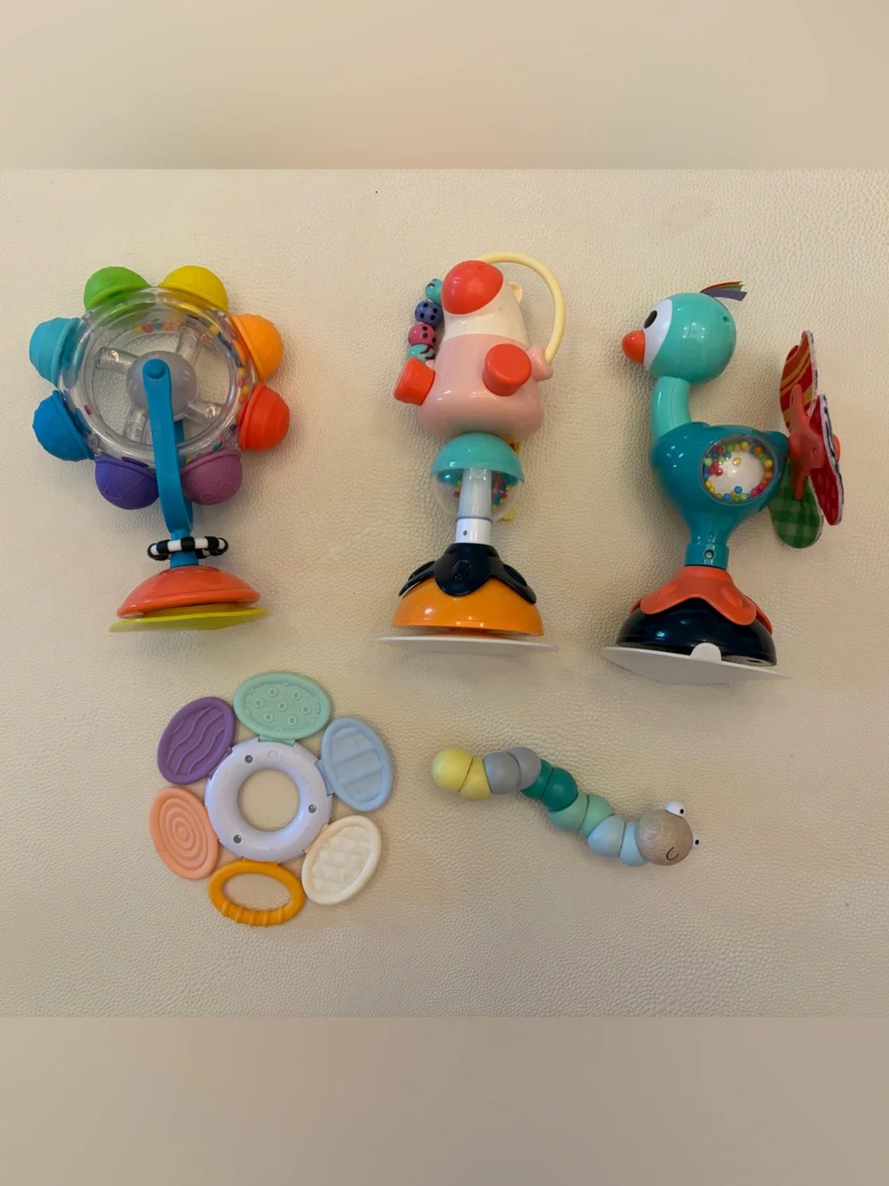 infant toy bundle including rattle and suction spinners